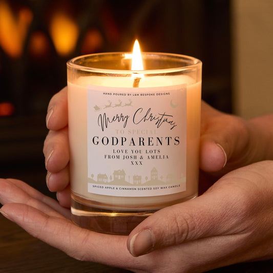 Candle labeled 'Special Godparents' held in hands with a warm background